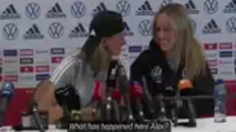 Alexandra Popp wears fake moustache to Germany news conference.