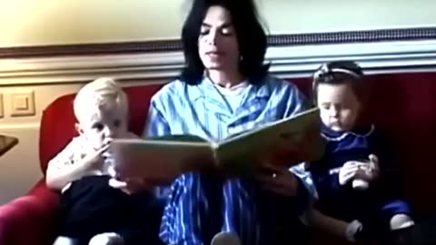 Michael Jackson reading a book to his children