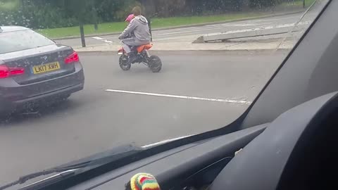 Biker Runs Red Light with Baby Onboard