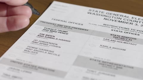 Close Up Hand Voting for Donald Trump on Ballot Paper in US Election