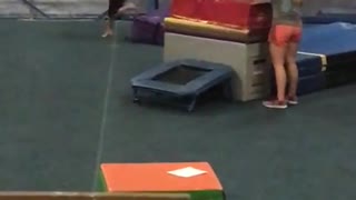 Pink gymanstics trampoline faceplant