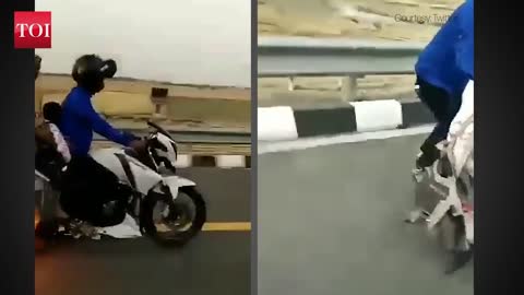 Miraculous save for couple on a bike