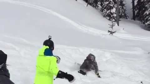 Backflip fail ski green jacket lady helps