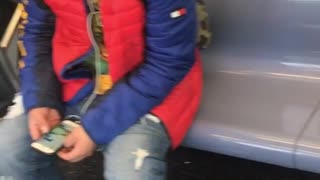 Man sits next to poop smear on subway seat