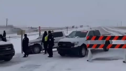 Farmers break through police barricades near Coutts, Canada