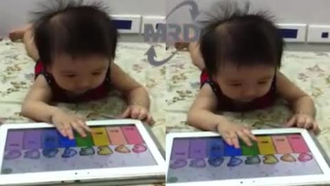 AMAZING BABY PIANO PLAYER - Baby playing the piano on the phone