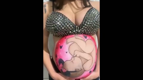 Pregnant woman gets beautiful painting of baby on her stomach!