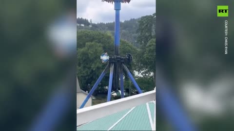 Dozens dangle upside down high on a ride in Portland amusement park