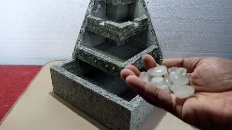 Homemade Styrofoam and cement mini water fountain waterfall