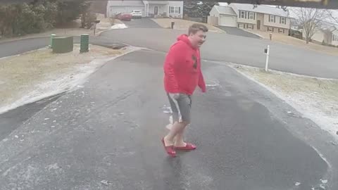 Guy Slips And Falls On His Butt While Walking On Icy Road