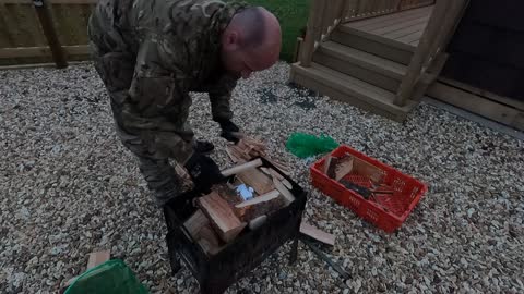 Prepping portable fire pit for a glorious fire