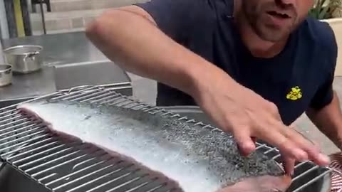 Peeling fish skin with boiling water
