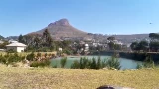 Helicopters collecting water at reservoir
