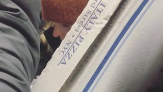 Pizza box subway being held sideways