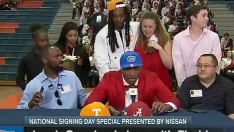 College Star Football Recruit Walks Off Stage When He Chooses Another School