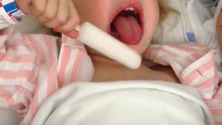 Little Girl Struggles To Eat Popsicle