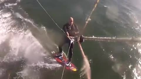 Scary moment while surfing whale jump across