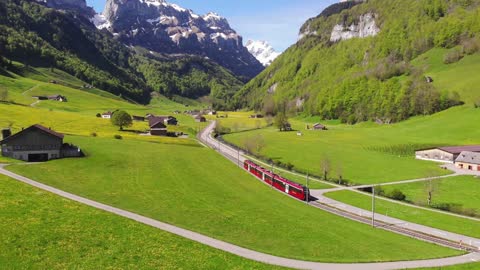 Drone Footage of a Train Traveling on a Valley