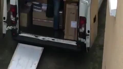 A bad day at work: Delivery guy is run over by products in delivery truck