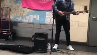 Musician plays 24k magic bruno mars on guitar in subway station