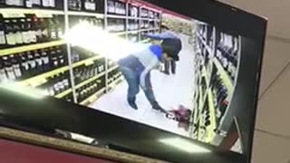Man drops bottle of wine on security cam