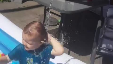 Toddler Loves Getting Water Poured On Him