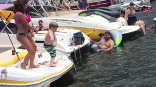 Boy Dances Like A Professional During A Lake Boat Race