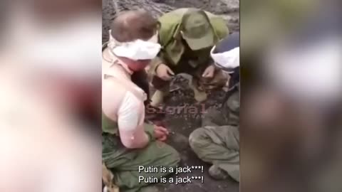A Georgian mercenary in Ukraine taunts & abuses two Russian prisoners 2022