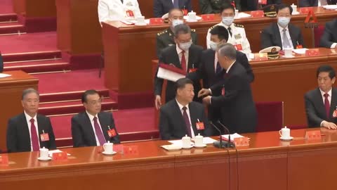 What happened before former Chinese President Hu Jintao was escorted out of Congres