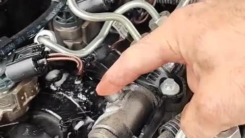 A gadget with a breakdown in the engine of a car