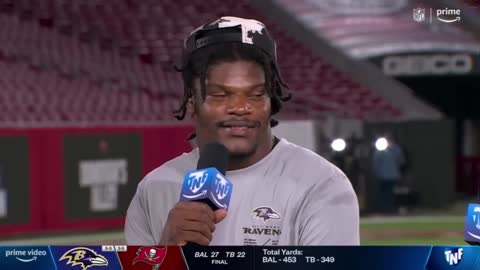 Fans yell -TAMPA BAY BUCCANEERS WHAT HAPPENDUHH- during Lamar Jackson interview