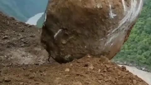 A Big Stone Dropped Into River with crane