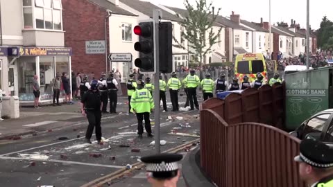 Anti-Muslim protesters clash with police in Southport