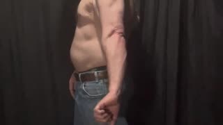 Fat man flexes his flab 4 of 14