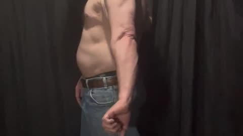 Fat man flexes his flab 4 of 14