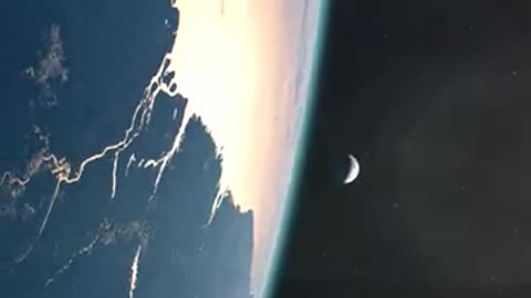 Earth 🌍 rotating and moon 🌑 rising behind earth horizon