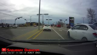 Distracted driver casually waiting for a green light, at a green light...