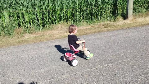 Kid rides a trike!