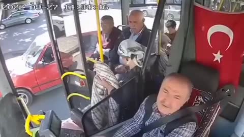 Turkish bus driver looks to camera, before failing.