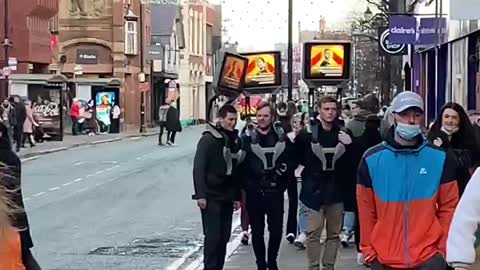 UK: Walking billboard advertising the covid 'vaccinations.'