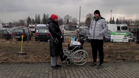 Ukraine refugees arrive at Polish camp