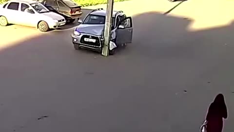 distracted driver runs straight into a pole in car park