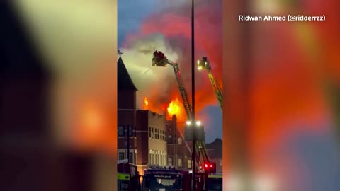 Huge fire spews from East London police station roof