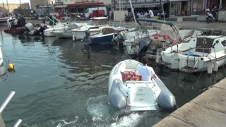 Exploring France. Sleeping rough in Saint Tropez. Billionaire yachts behind the wall.