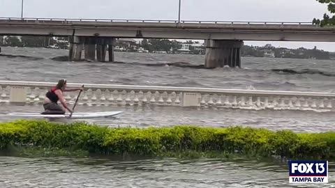 Florida Man paddle down flooded tampa street after hurricane Idalia