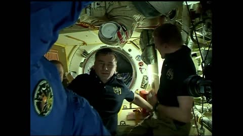 Expedition Crew Docks to the Space Station