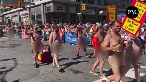 Naked people march in the Toronto Pride Parade.