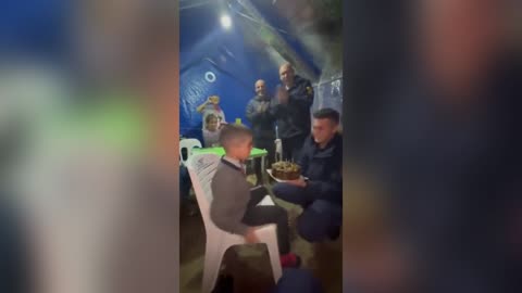 Soldiers Help Celebrate Child's Birthday In Shelter Home