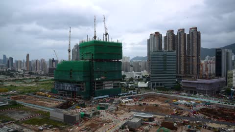 Time-lapse video of a construction site under cloudy sky