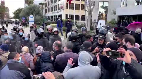 Tunisian police fire water canon at protesters